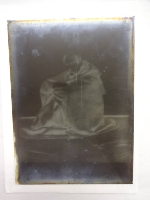 Sir Richard Burton sitting on the floor in his Jubbah