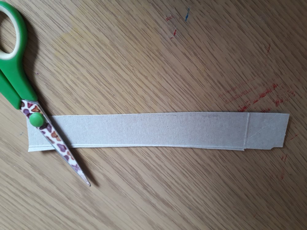 Scissors and a thin strip of card