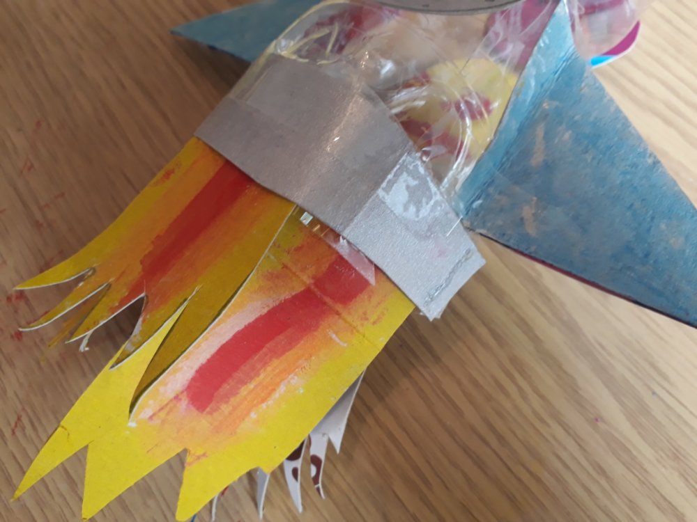 Image of flames attached to the bottom of the rocket