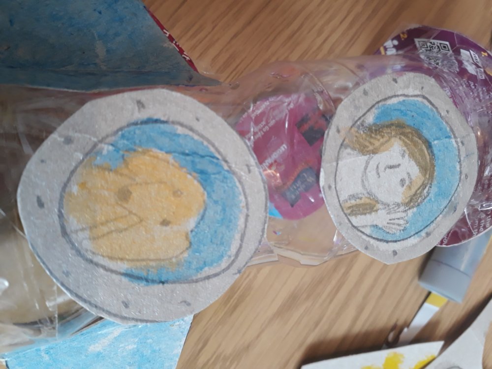 Circular windows taped onto the plastic bottle