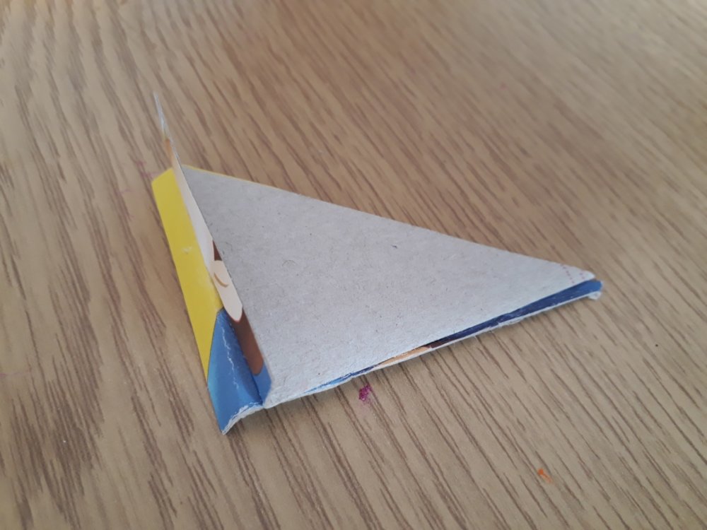 A cardboard trinagle with a tab at the end