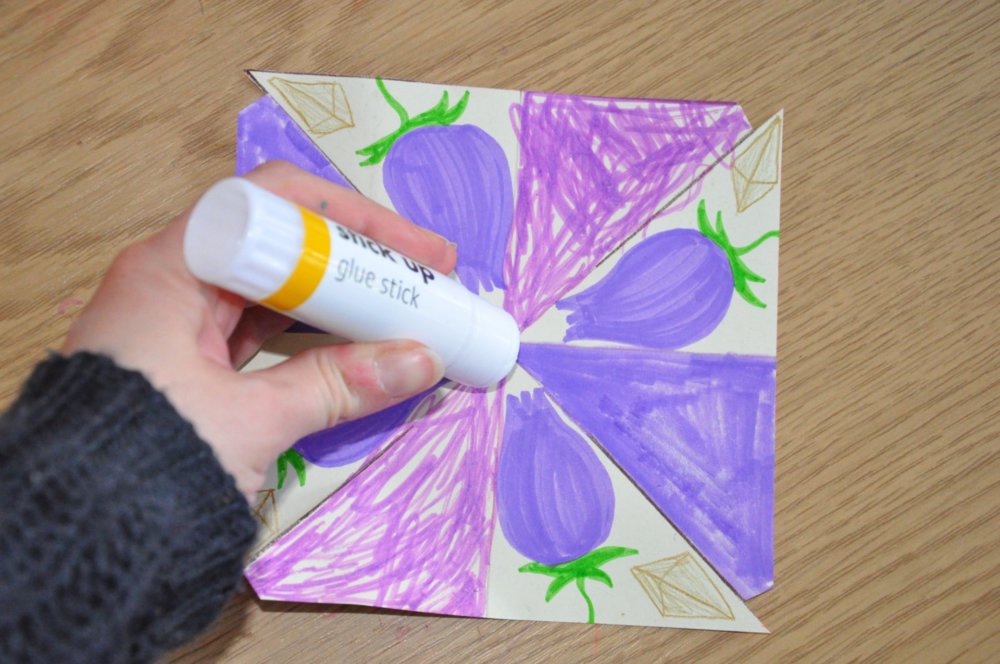 A glue stick on the middle of the square.