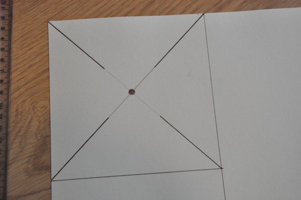 Thick lines on the cross in the square and a dot in the centre.