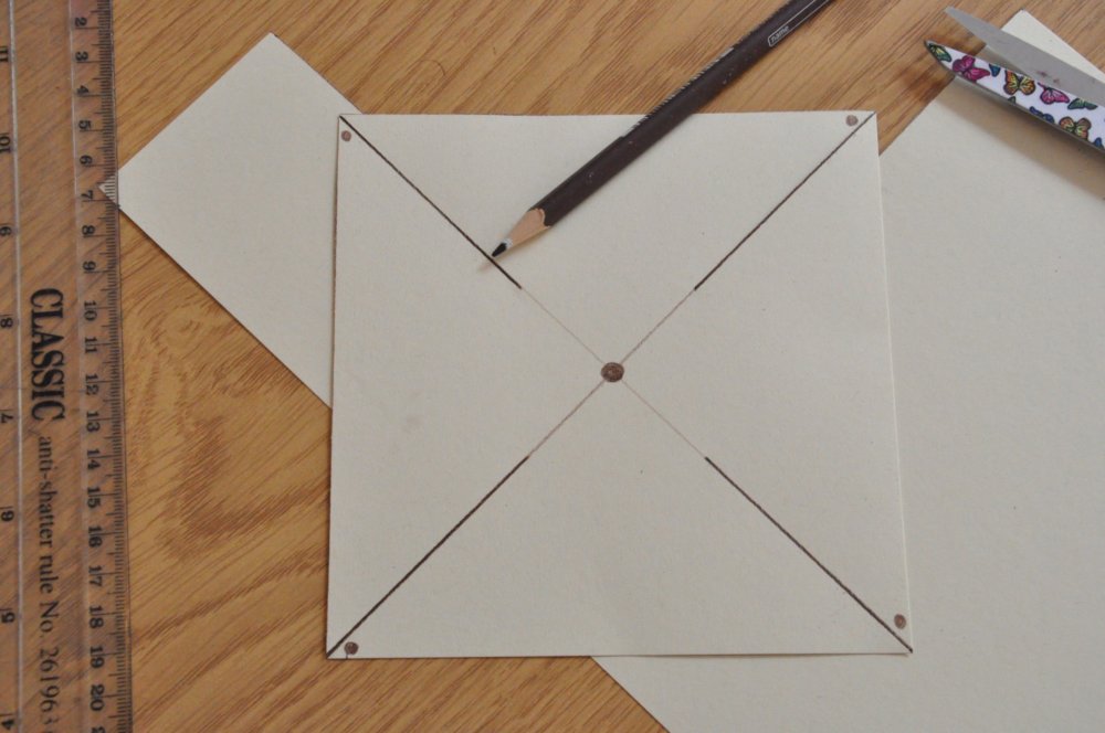 Square paper with lines and dots.
