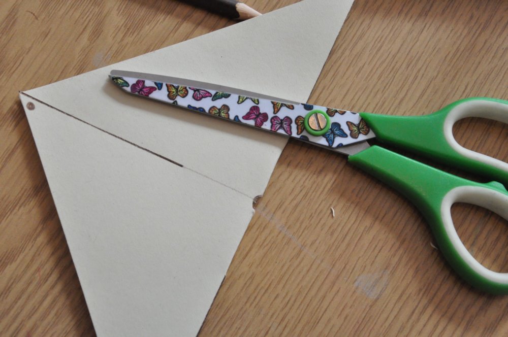 Square folded in half with scissors.