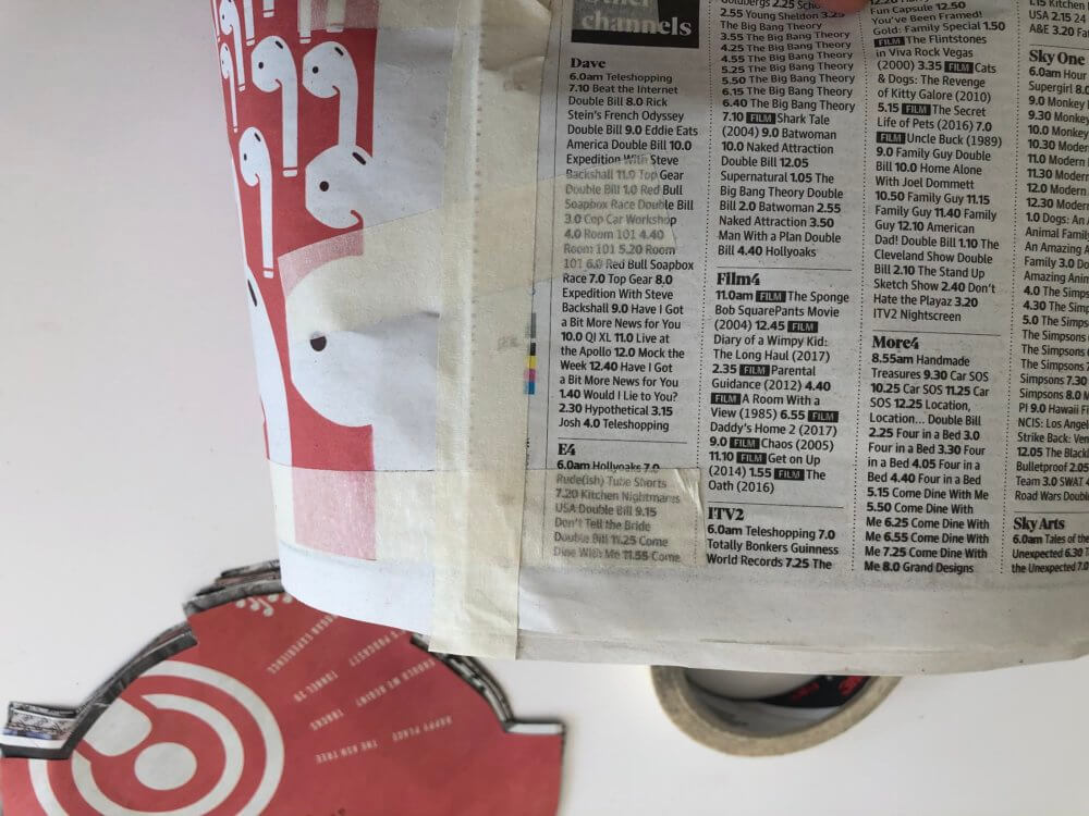 Masking tape attaching sheets of newspaper together.