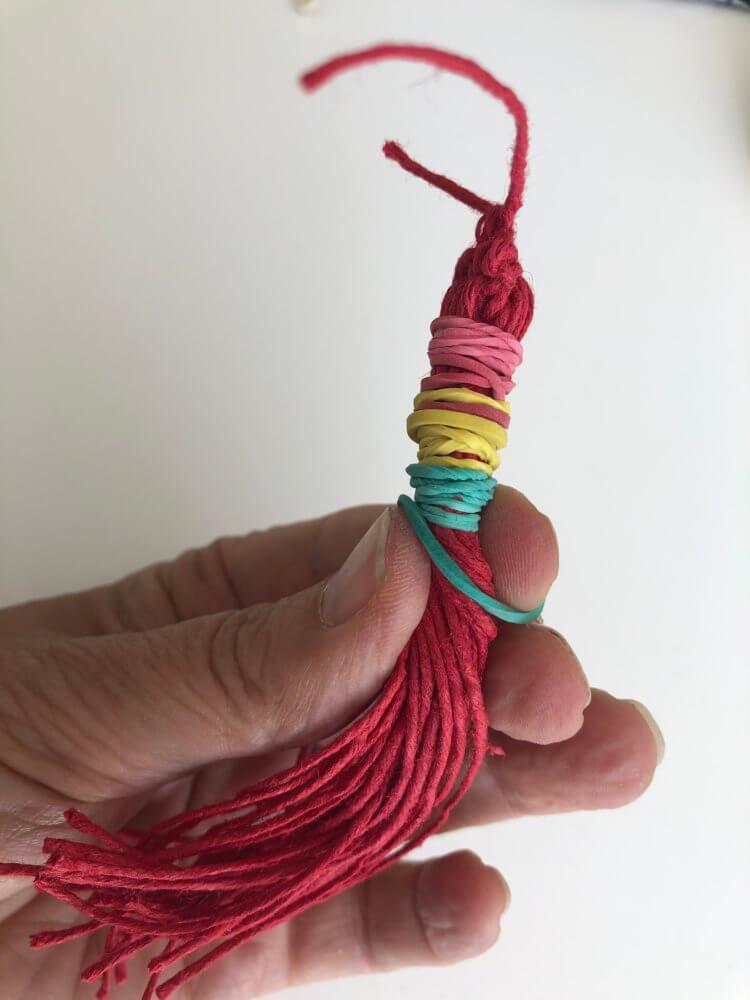 Elastic bands tied around the tassel.