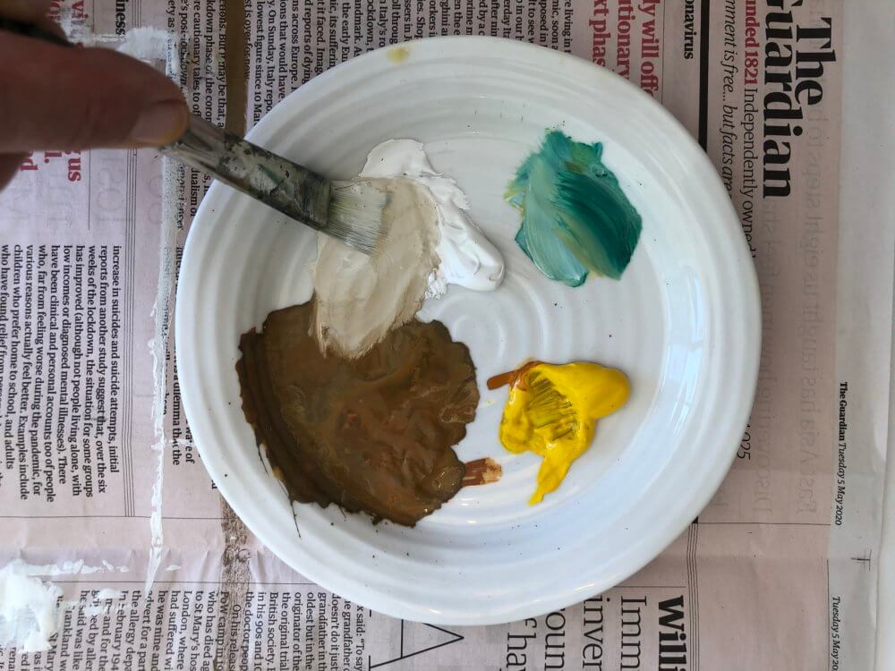 A paintbrush in a palette